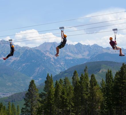 People ziplining the Game Creek Zipline in Vail