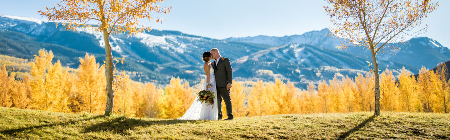 Sharing a first kiss in front of Snowmass' stunning mountains