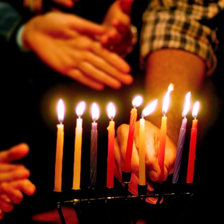 Candles lit on menorah
