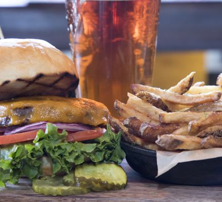 Monday night's special - the signature burger, fries, and a beer from The Artisan, inside the Stonebridge Inn, Snowmass Village, Colorado