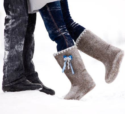 Couple's boots in the snow