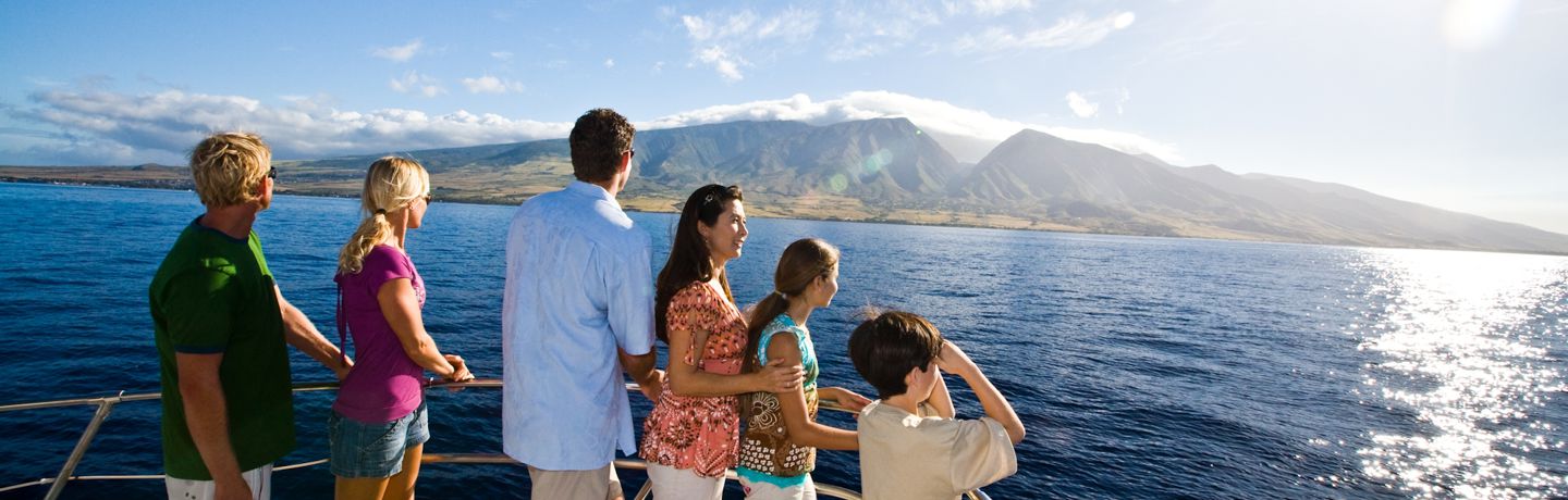 Group on boat viewing the West Maui Mountains