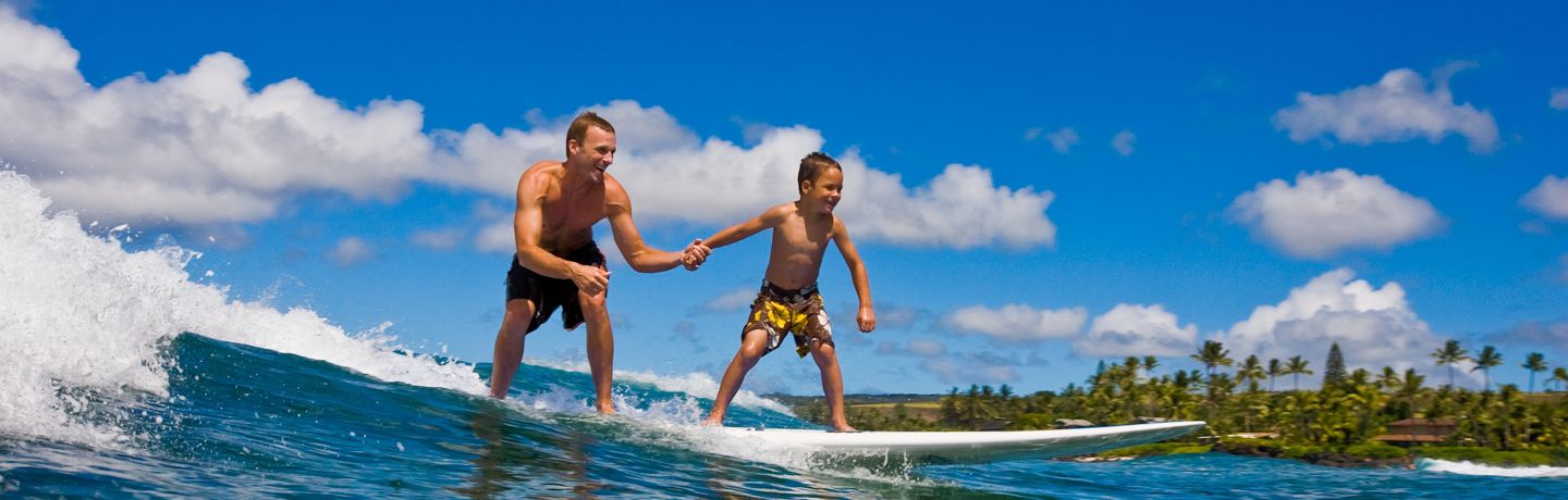 Father and son tandem surfing