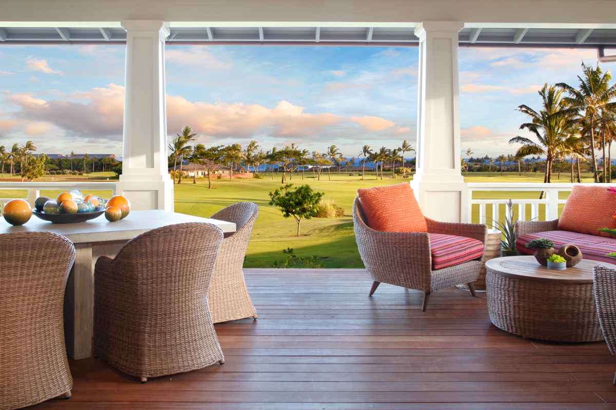 Spacious main floor lanai with dining table for six and comfortable seating area. View over fairway to ocean. 