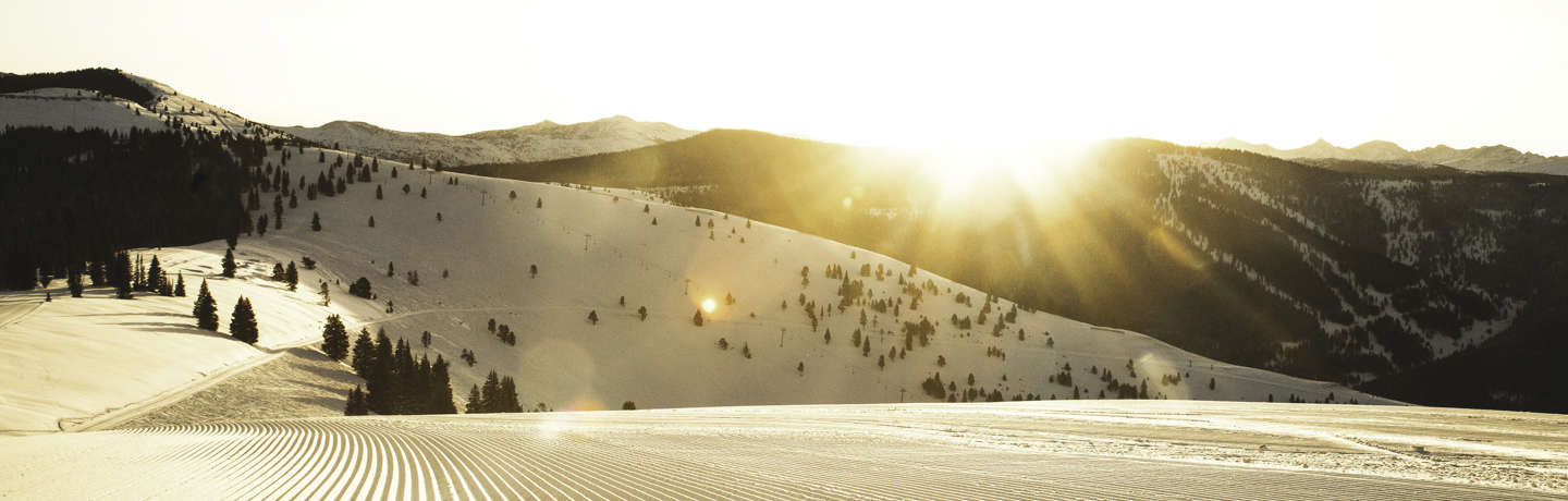 <b>Freshly groomed trail at sunrise in Vail, CO.</b>
