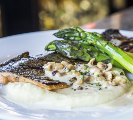 A signature dish of The Artisan - Grilled Ruby Red Trout - inside the Stonebridge Inn, Snowmass Village, Colorado