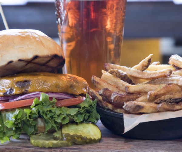 Monday night's special - the signature burger, fries, and a beer from The Artisan, inside the Stonebridge Inn, Snowmass Village, Colorado