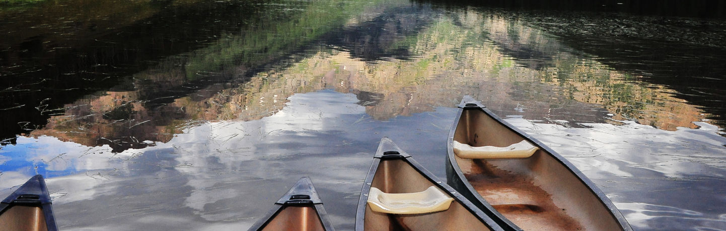 Canoes In Water During Summer