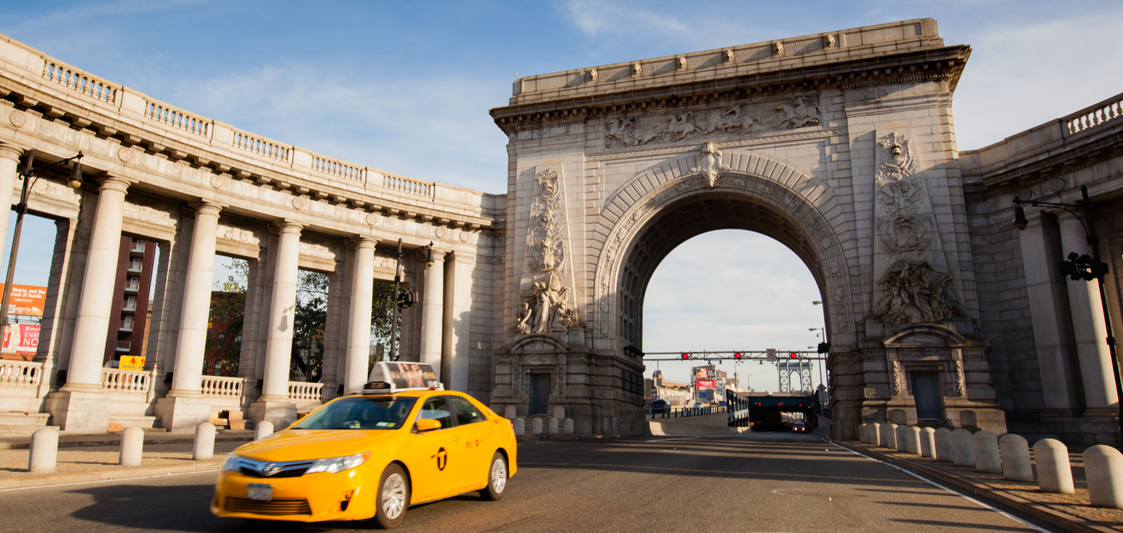 Taxi In Front Of Manhattan Bridge Archway